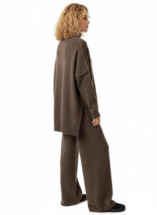 Woman in a dark brown knit high-neck loungewear set with an oversized sweater and wide-leg pants.